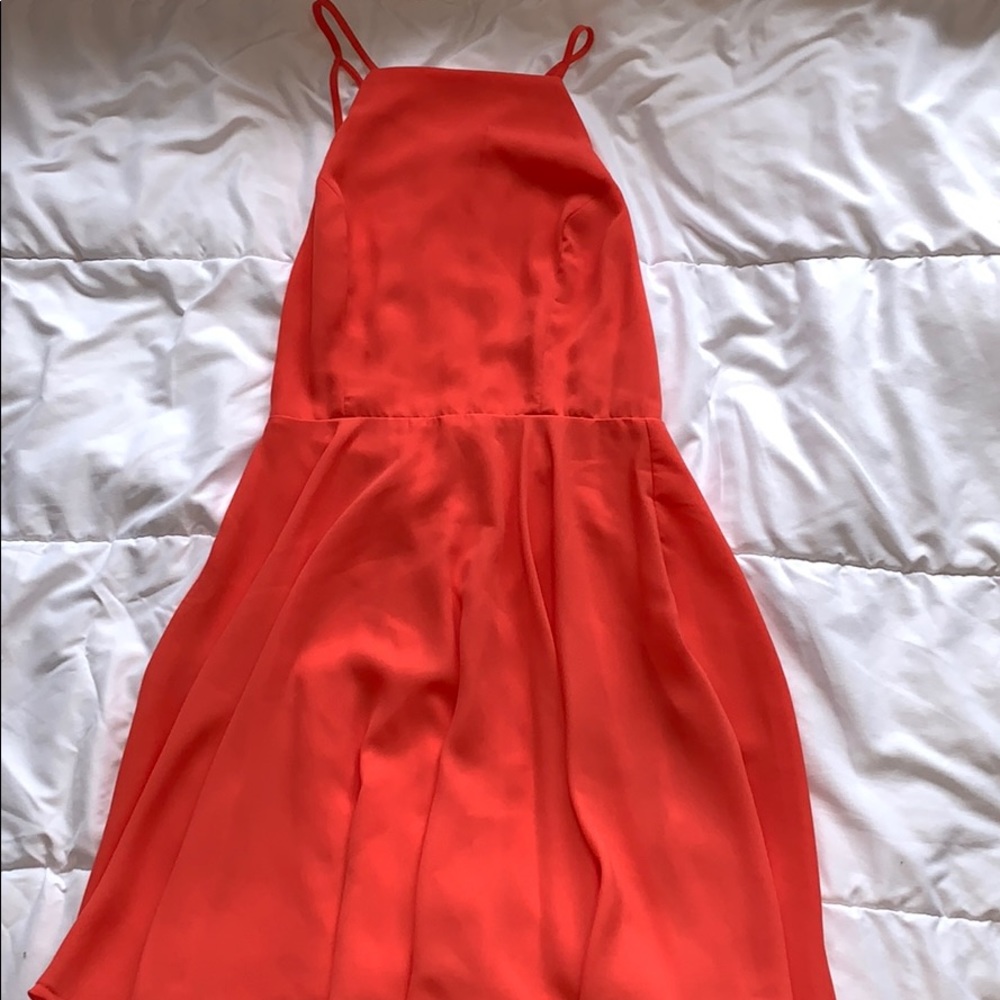 Coral colored mini dress.